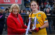 8 June 2024; Antrim captain Ella McLaughlin receives the trophy from Westmeath LGFA chairperson, Geraldine Giles, following the 2024 All-Ireland U14 Bronze Final between Limerick and Antrim at Coralstown Kinnegad GAA Club in Kinnegad, Westmeath. Photo by Shauna Clinton/Sportsfile