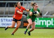 8 June 2024; Emma Duggan of Meath in action against Niamh Henderson of Armagh during the TG4 All-Ireland Ladies Senior Football Championship Round 1 match between Armagh and Meath at BOX-IT Athletic Grounds in Armagh. Photo by Tyler Miller/Sportsfile