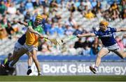 8 June 2024; Dan Bourke of Offaly has his shot blocked by Pádraig Delaney of Laois during the Joe McDonagh Cup final match between Laois and Offaly at Croke Park in Dublin. Photo by John Sheridan/Sportsfile