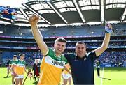 8 June 2024; Brian Duignan of Offaly celebrates with his father and Chairman of the Offaly County Board Michael Duignan after the Joe McDonagh Cup final match between Laois and Offaly at Croke Park in Dublin. Photo by Piaras Ó Mídheach/Sportsfile