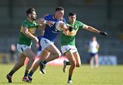 8 June 2024; Padraig O Toole of Wicklow in action against Mark Plunkett, left, and Kieran Clancy of Leitrim during the Tailteann Cup preliminary quarter-final match between Leitrim and Wicklow at Glennon Brothers Pearse Park in Longford. Photo by Stephen Marken/Sportsfile