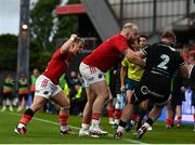 7 June 2024; Craig Casey of Munster celebrates as Dewi Lake of Ospreys is tackled into touch by Jeremy Loughman of Munster during the United Rugby Championship quarter-final match between Munster and Ospreys at Thomond Park in Limerick. Photo by Harry Murphy/Sportsfile