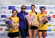 9 June 2024; Irish Life chief people officer Barbar O'Malley with the women's winners, first place Faye Dervan of Dublin City Harriers AC, Caitlyn Harvey of North East Runners AC, Louth, and Sarah Mulligan of Dundrum South Dublin AC on the podium after the 2024 Irish Life Dublin Race Series Corkagh Park 5 Mile at Corkagh Park in Dublin. Photo by Seb Daly/Sportsfile
