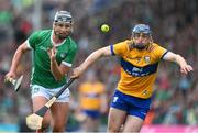 9 June 2024; Gearóid Hegarty of Limerick is tackled by David McInerney of Clare during the Munster GAA Hurling Senior Championship final match between Clare and Limerick at FBD Semple Stadium in Thurles, Tipperary. Photo by Ray McManus/Sportsfile