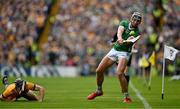 9 June 2024; Gearóid Hegarty of Limerick scores a point despite the best efforts of David McInerney of Clare during the Munster GAA Hurling Senior Championship final match between Clare and Limerick at FBD Semple Stadium in Thurles, Tipperary. Photo by Brendan Moran/Sportsfile