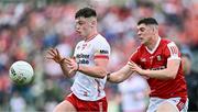 15 June 2024; Ben Cullen of Tyrone in action against Rory Maguire of Cork during the GAA Football All-Ireland Senior Championship Round 3 match between Cork and Tyrone at Glenisk O'Connor Park in Tullamore, Offaly. Photo by Piaras Ó Mídheach/Sportsfile