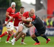 15 June 2024; Jeremy Loughman of Munster is tackled by Jamie Bhatti of Glasgow Warriors during the United Rugby Championship semi-final match between Munster and Glasgow Warriors at Thomond Park in Limerick. Photo by Brendan Moran/Sportsfile