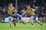 15 June 2024; Oisin Brady of Cavan in action against David Murray of Roscommon during the GAA Football All-Ireland Senior Championship Round 3 match between Cavan and Roscommon at Glennon Brothers Pearse Park in Longford. Photo by Daire Brennan/Sportsfile