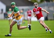 15 June 2024; Brian Duignan of Offaly gets away from Mark Coleman of Cork during the GAA Hurling All-Ireland Senior Championship preliminary quarter-final match between Offaly and Cork at Glenisk O'Connor Park in Tullamore, Offaly. Photo by Piaras Ó Mídheach/Sportsfile