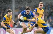 15 June 2024; Oisin Brady of Cavan in action against David Murray of Roscommon during the GAA Football All-Ireland Senior Championship Round 3 match between Cavan and Roscommon at Glennon Brothers Pearse Park in Longford. Photo by Daire Brennan/Sportsfile