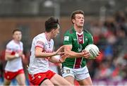 15 June 2024; John Heslin of Westmeath in action against Paul Cassidy of Derry during the GAA Football All-Ireland Senior Championship Round 3 match between Derry and Westmeath at Páirc Esler in Newry, Down. Photo by Sam Barnes/Sportsfile