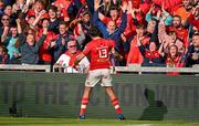 15 June 2024; Antoine Frisch of Munster celebrates with supporters after scoring their side's first try during the United Rugby Championship semi-final match between Munster and Glasgow Warriors at Thomond Park in Limerick. Photo by Brendan Moran/Sportsfile