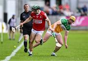 15 June 2024; Mark Coleman of Cork in action against Killian Sampson of Offaly during the GAA Hurling All-Ireland Senior Championship preliminary quarter-final match between Offaly and Cork at Glenisk O'Connor Park in Tullamore, Offaly. Photo by Piaras Ó Mídheach/Sportsfile
