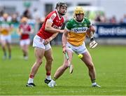 15 June 2024; Killian Sampson of Offaly in action against Mark Coleman of Cork during the GAA Hurling All-Ireland Senior Championship preliminary quarter-final match between Offaly and Cork at Glenisk O'Connor Park in Tullamore, Offaly. Photo by Piaras Ó Mídheach/Sportsfile