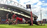 15 June 2024; Antoine Frisch of Munster scores his side's first try despite the efforts of Sebastian Cancelliere of Glasgow Warriors during the United Rugby Championship semi-final match between Munster and Glasgow Warriors at Thomond Park in Limerick. Photo by Brendan Moran/Sportsfile