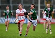 15 June 2024; Diarmuid Baker of Derry in action against John Heslin of Westmeath during the GAA Football All-Ireland Senior Championship Round 3 match between Derry and Westmeath at Páirc Esler in Newry, Down. Photo by Sam Barnes/Sportsfile