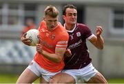 16 June 2024; Rian O’Neill of Armagh is tackled by John Maher of Galway during the GAA Football All-Ireland Senior Championship Round 3 match between Armagh and Galway at Markievicz Park in Sligo. Photo by Brendan Moran/Sportsfile