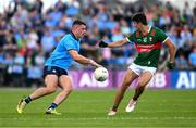 16 June 2024; Brian Howard of Dublin in action against Tommy Conroy of Mayo during the GAA Football All-Ireland Senior Championship Round 3 match between Dublin and Mayo at Dr Hyde Park in Roscommon. Photo by Daire Brennan/Sportsfile