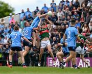 16 June 2024; Brian Fenton of Dublin in action against Rory Brickenden of Mayo during the GAA Football All-Ireland Senior Championship Round 3 match between Dublin and Mayo at Dr Hyde Park in Roscommon. Photo by Daire Brennan/Sportsfile
