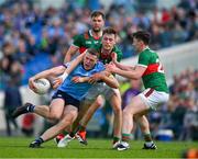 16 June 2024; Brian Fenton of Dublin is tackled by Donnacha McHugh, centre, and Diarmuid O’Connor of Mayo, resulting in a free to Mayo, during the GAA Football All-Ireland Senior Championship Round 3 match between Dublin and Mayo at Dr Hyde Park in Roscommon. Photo by Ray McManus/Sportsfile