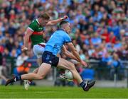 16 June 2024; Ryan O'Donoghue of Mayo has a shot on goal blocked by Brian Fenton of Dublin during the GAA Football All-Ireland Senior Championship Round 3 match between Dublin and Mayo at Dr Hyde Park in Roscommon. Photo by Ray McManus/Sportsfile