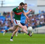16 June 2024; Matthew Ruane of Mayo in action against Tom Lahiff of Dublin during the GAA Football All-Ireland Senior Championship Round 3 match between Dublin and Mayo at Dr Hyde Park in Roscommon. Photo by Ray McManus/Sportsfile