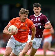 16 June 2024; Oisín O’Neill of Armagh in action against Tomo Culhane of Galway during the GAA Football All-Ireland Senior Championship Round 3 match between Armagh and Galway at Markievicz Park in Sligo. Photo by Brendan Moran/Sportsfile