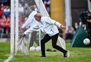 15 June 2024; Umpire Pat McTiernan reaches for the white flag to signal a point for Tyrone during the GAA Football All-Ireland Senior Championship Round 3 match between Cork and Tyrone at Glenisk O'Connor Park in Tullamore, Offaly. Photo by Piaras Ó Mídheach/Sportsfile