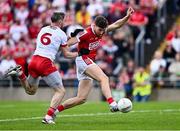 15 June 2024; Paul Walsh of Cork in action against Matthew Donnelly of Tyrone during the GAA Football All-Ireland Senior Championship Round 3 match between Cork and Tyrone at Glenisk O'Connor Park in Tullamore, Offaly. Photo by Piaras Ó Mídheach/Sportsfile
