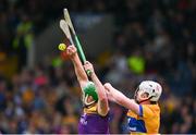 22 June 2024; Conor McDonald of Wexford in action against Adam Hogan of Clare during the GAA Hurling All-Ireland Senior Championship quarter-final match between Clare and Wexford at FBD Semple Stadium in Thurles, Tipperary. Photo by Ray McManus/Sportsfile