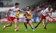 22 June 2024; Donie Smith of Roscommon in action against Michael McKernan, left, and Michael O’Neill of Tyrone during the GAA Football All-Ireland Senior Championship preliminary quarter-final match between Tyrone and Roscommon at O'Neill's Healy Park in Omagh, Tyrone. Photo by Ben McShane/Sportsfile
