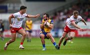 22 June 2024; Donie Smith of Roscommon in action against Michael McKernan, left, and Michael O’Neill of Tyrone during the GAA Football All-Ireland Senior Championship preliminary quarter-final match between Tyrone and Roscommon at O'Neill's Healy Park in Omagh, Tyrone. Photo by Ben McShane/Sportsfile
