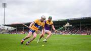 22 June 2024; Adam Hogan of Clare and Conor McDonald of Wexford fight for possession, near the end line, during the GAA Hurling All-Ireland Senior Championship quarter-final match between Clare and Wexford at FBD Semple Stadium in Thurles, Tipperary. Photo by Ray McManus/Sportsfile