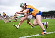 22 June 2024; Adam Hogan of Clare and Conor McDonald of Wexford fight for possession, near the end line, during the GAA Hurling All-Ireland Senior Championship quarter-final match between Clare and Wexford at FBD Semple Stadium in Thurles, Tipperary. Photo by Ray McManus/Sportsfile