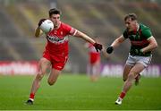 22 June 2024; Conor Doherty of Derry in action against Eoghan McLaughlin of Mayo during the GAA Football All-Ireland Senior Championship preliminary quarter-final match between Mayo and Derry at Hastings Insurance MacHale Park in Castlebar, Mayo. Photo by Seb Daly/Sportsfile