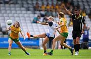 23 June 2024; Annie Fitzgerald of Waterford kicks at goal under pressure from Donegal's Amy Boyle Carr, left, during the TG4 All-Ireland Ladies Football Senior Championship Round 3 match between Waterford and Donegal at Walsh Park in Waterford. Photo by Seb Daly/Sportsfile
