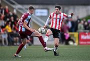 28 June 2024; Colm Whelan of Derry City in action against Jack Keaney of Drogheda United during the SSE Airtricity Men's Premier Division match between Derry City and Drogheda United at The Ryan McBride Brandywell Stadium in Derry. Photo by Ben McShane/Sportsfile