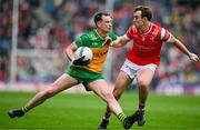 30 June 2024; Ciaran Thompson of Donegal is tackled by Bevan Duffy of Louth during the GAA Football All-Ireland Senior Championship quarter-final match between Donegal and Louth at Croke Park in Dublin. Photo by Brendan Moran/Sportsfile