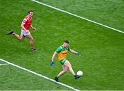 30 June 2024; Jamie Brennan of Donegal shoots as Bevan Duffy of Louth closes in during the GAA Football All-Ireland Senior Championship quarter-final match between Donegal and Louth at Croke Park in Dublin. Photo by Piaras Ó Mídheach/Sportsfile