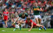 30 June 2024; Jason Foley of Kerry and Shane McGuigan of Derry compete for possession during the GAA Football All-Ireland Senior Championship quarter-final match between Kerry and Derry at Croke Park in Dublin. Photo by Brendan Moran/Sportsfile