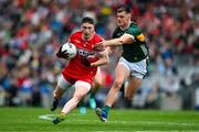 30 June 2024; Gareth McKinless of Derry is tackled by Diarmuid O'Connor of Kerry during the GAA Football All-Ireland Senior Championship quarter-final match between Kerry and Derry at Croke Park in Dublin. Photo by Brendan Moran/Sportsfile