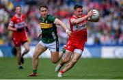 30 June 2024; Eunan Mulholland of Derry is tackled by Dara Moynihan of Kerry during the GAA Football All-Ireland Senior Championship quarter-final match between Kerry and Derry at Croke Park in Dublin. Photo by Shauna Clinton/Sportsfile