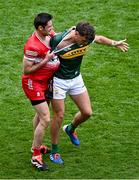 30 June 2024; Christopher McKaigue of Derry and David Clifford of Kerry tussle off the ball during the GAA Football All-Ireland Senior Championship quarter-final match between Kerry and Derry at Croke Park in Dublin. Photo by Piaras Ó Mídheach/Sportsfile