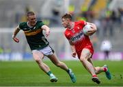30 June 2024; Lachlan Murray of Derry in action against Jason Foley of Kerry during the GAA Football All-Ireland Senior Championship quarter-final match between Kerry and Derry at Croke Park in Dublin. Photo by John Sheridan/Sportsfile