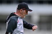 30 June 2024; Derry manager Mickey Harte checks his watch near the end of the GAA Football All-Ireland Senior Championship quarter-final match between Kerry and Derry at Croke Park in Dublin. Photo by Ben McShane/Sportsfile