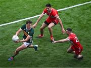 30 June 2024; David Clifford of Kerry in action against Derry players Christopher McKaigue and Niall Toner, right, during the GAA Football All-Ireland Senior Championship quarter-final match between Kerry and Derry at Croke Park in Dublin. Photo by Piaras Ó Mídheach/Sportsfile