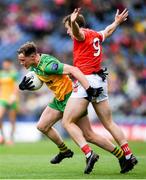 30 June 2024; Ciaran Thompson of Donegal in action against Bevan Duffy of Louth during the GAA Football All-Ireland Senior Championship quarter-final match between Donegal and Louth at Croke Park in Dublin. Photo by Shauna Clinton/Sportsfile
