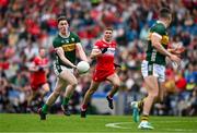 30 June 2024; Cillian Burke of Kerry passes to teammate Sean O'Shea during the GAA Football All-Ireland Senior Championship quarter-final match between Kerry and Derry at Croke Park in Dublin. Photo by Brendan Moran/Sportsfile