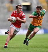 30 June 2024; Bevan Duffy of Louth and Daire O Baoill of Donegal during the GAA Football All-Ireland Senior Championship quarter-final match between Donegal and Louth at Croke Park in Dublin. Photo by Ben McShane/Sportsfile