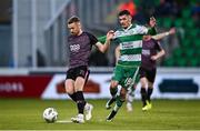 4 July 2024; Paul Doyle of Dundalk in action against Trevor Clarke of Shamrock Rovers during the SSE Airtricity Men's Premier Division match between Shamrock Rovers and Dundalk at Tallaght Stadium in Dublin. Photo by Seb Daly/Sportsfile